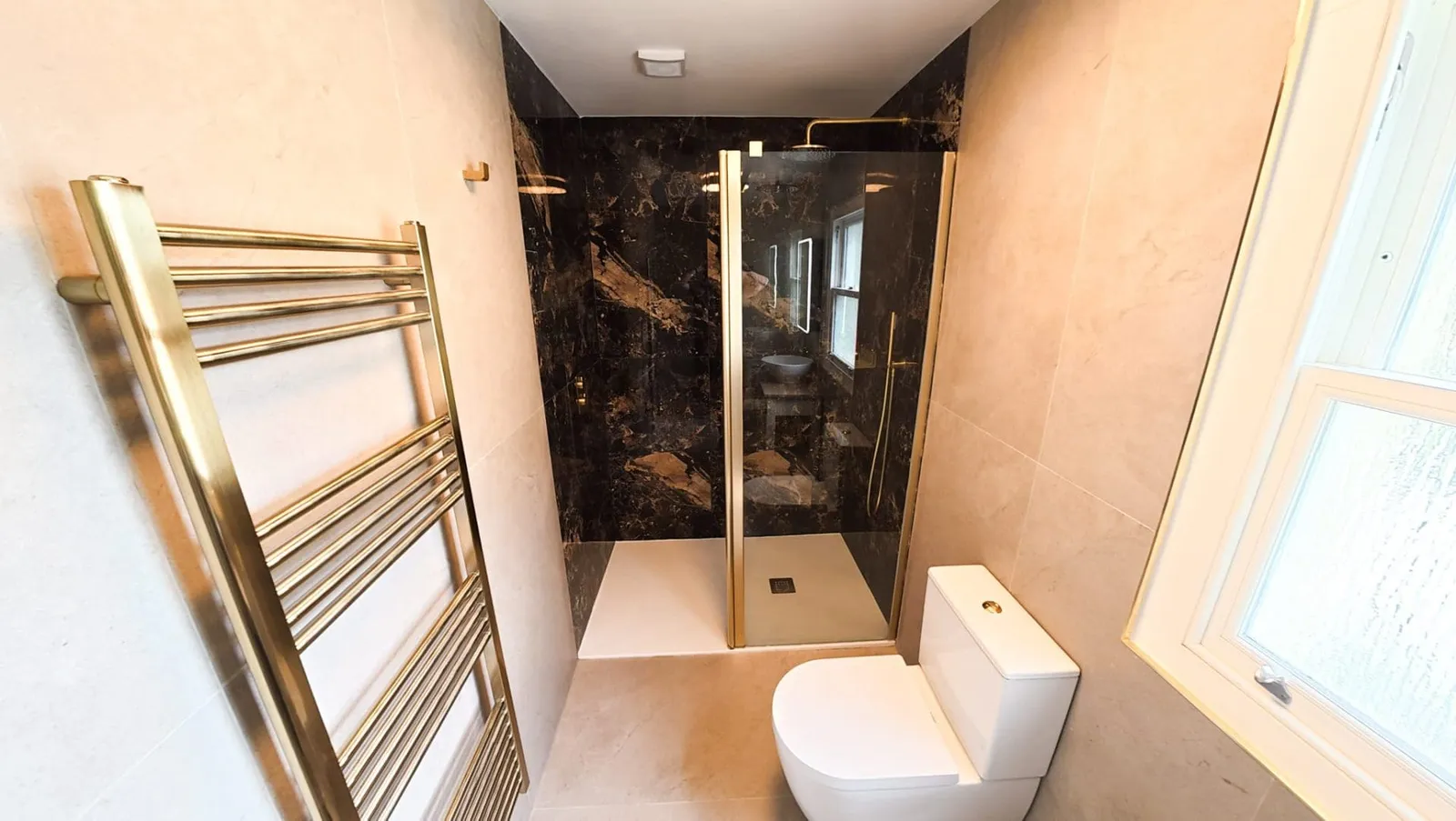 Luxury Tiled Bathroom with Brushed Brass fittings