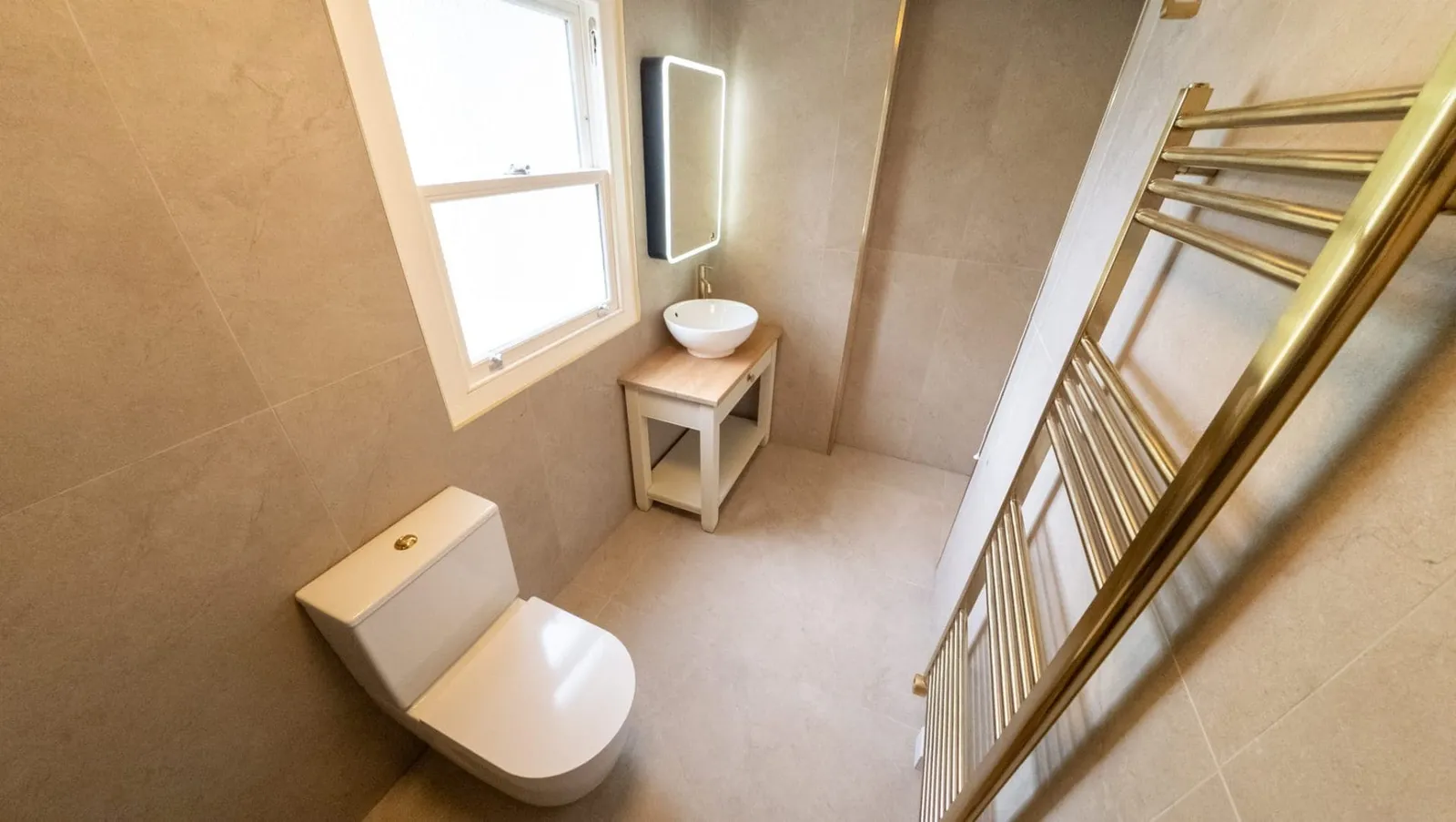 Luxury Tiled Bathroom with Brushed Brass fittings