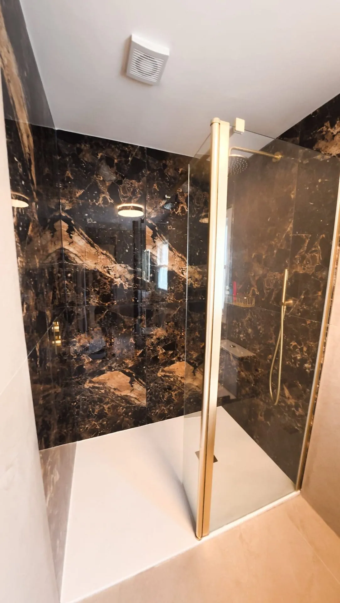 Luxury Tiled walk in shower area - brushed brass